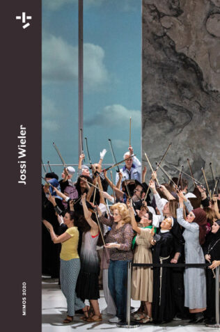 Group of people waving a stick in the sky